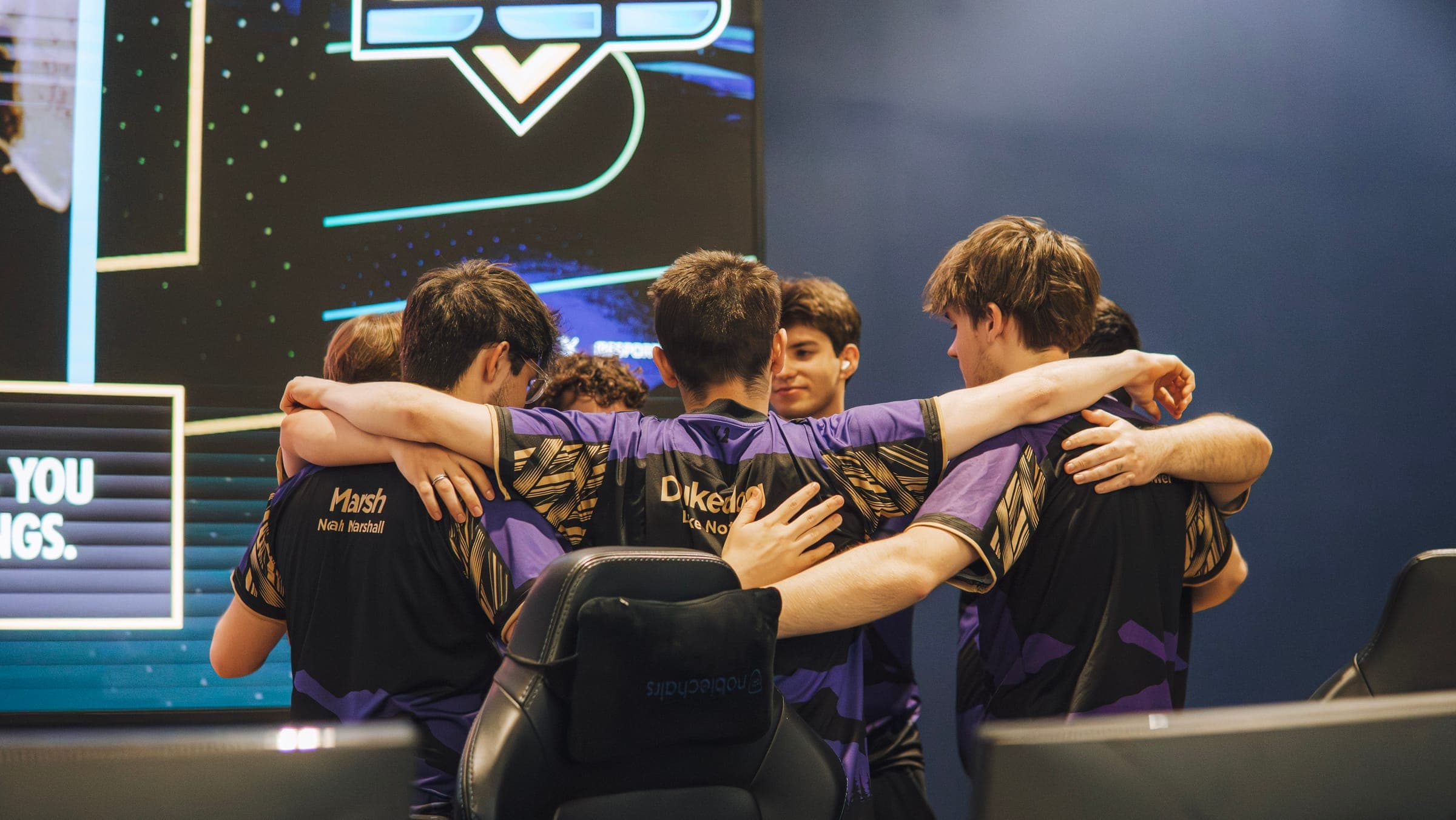 NEL team in a pre-match huddle at a championship event